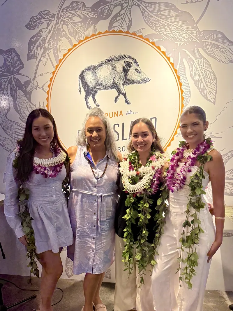 Wāhine talking together at a community networking event.